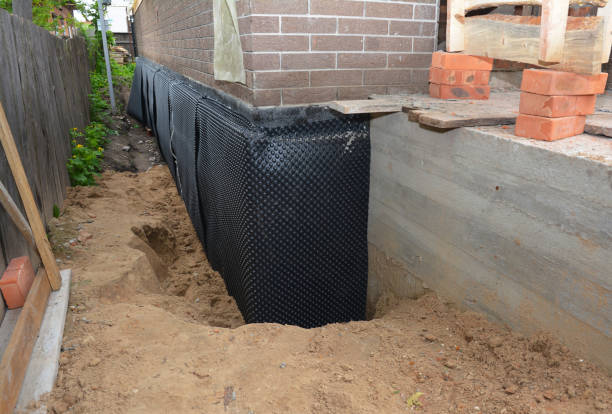 Happy homeowners after waterproofing job in Avenel